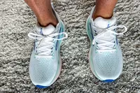 A person wearing the Brooks Women's Glycerin GTS 22 Running Shoes