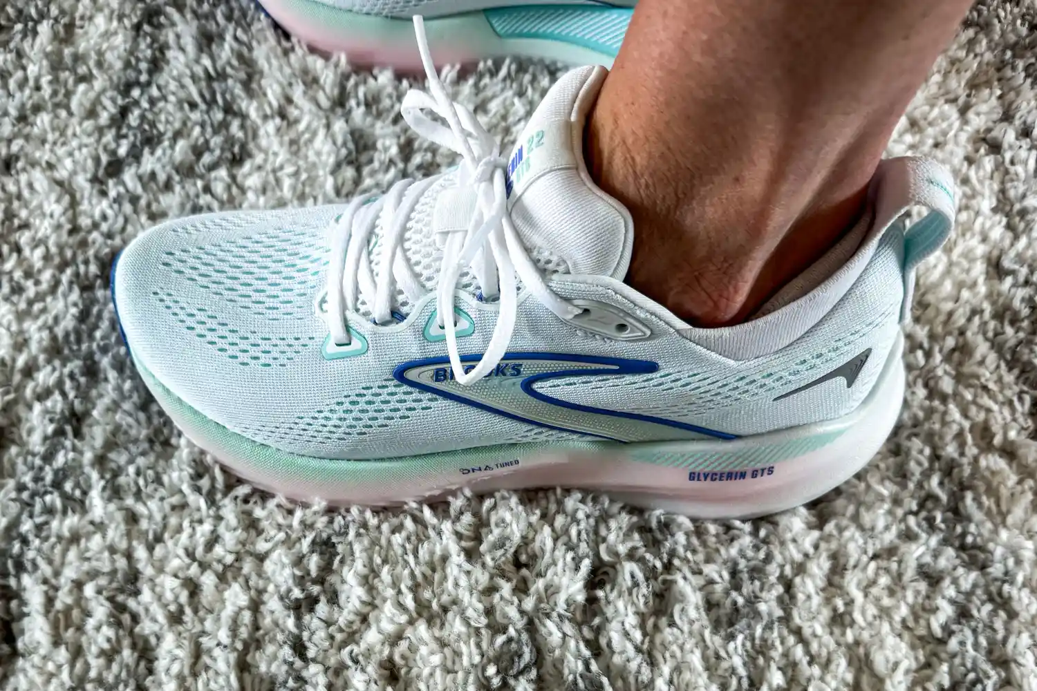 A person's foot wearing the Brooks Women's Glycerin GTS 22 Running Shoes