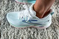 A person's foot wearing the Brooks Women's Glycerin GTS 22 Running Shoes