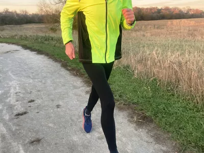 Person running outside wearing Rabbit Men's Pocket Tightz