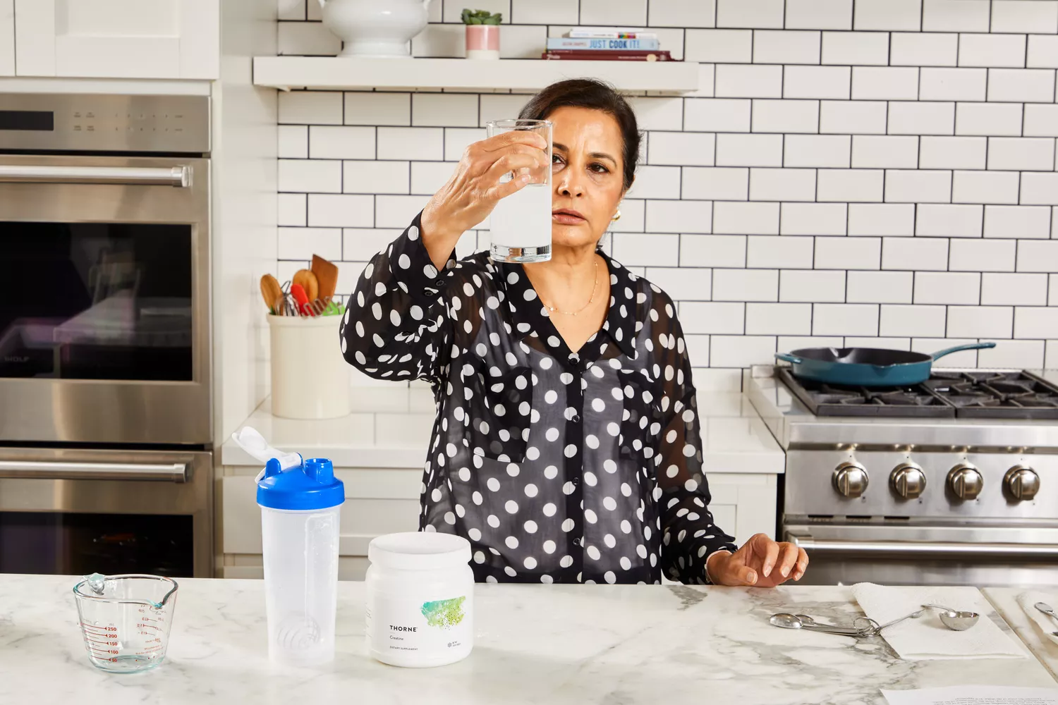 A person holds up a glass