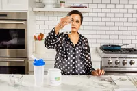 A person holds up a glass