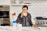 A person drinks Thorne Creatine