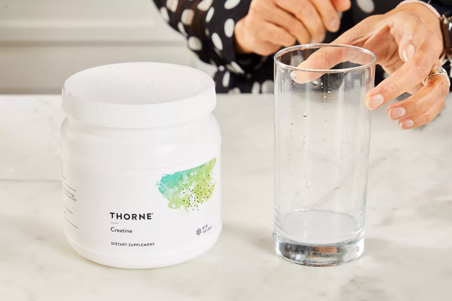 A glass of Thorne Creatine