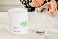 A glass of Thorne Creatine