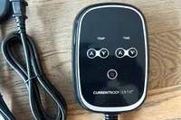 A close-up of the remote of the CurrentBody Skin Infrared Sauna Blanket