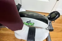 A person uses the DeskCycle 2 Under Desk Bike Pedal Exerciser