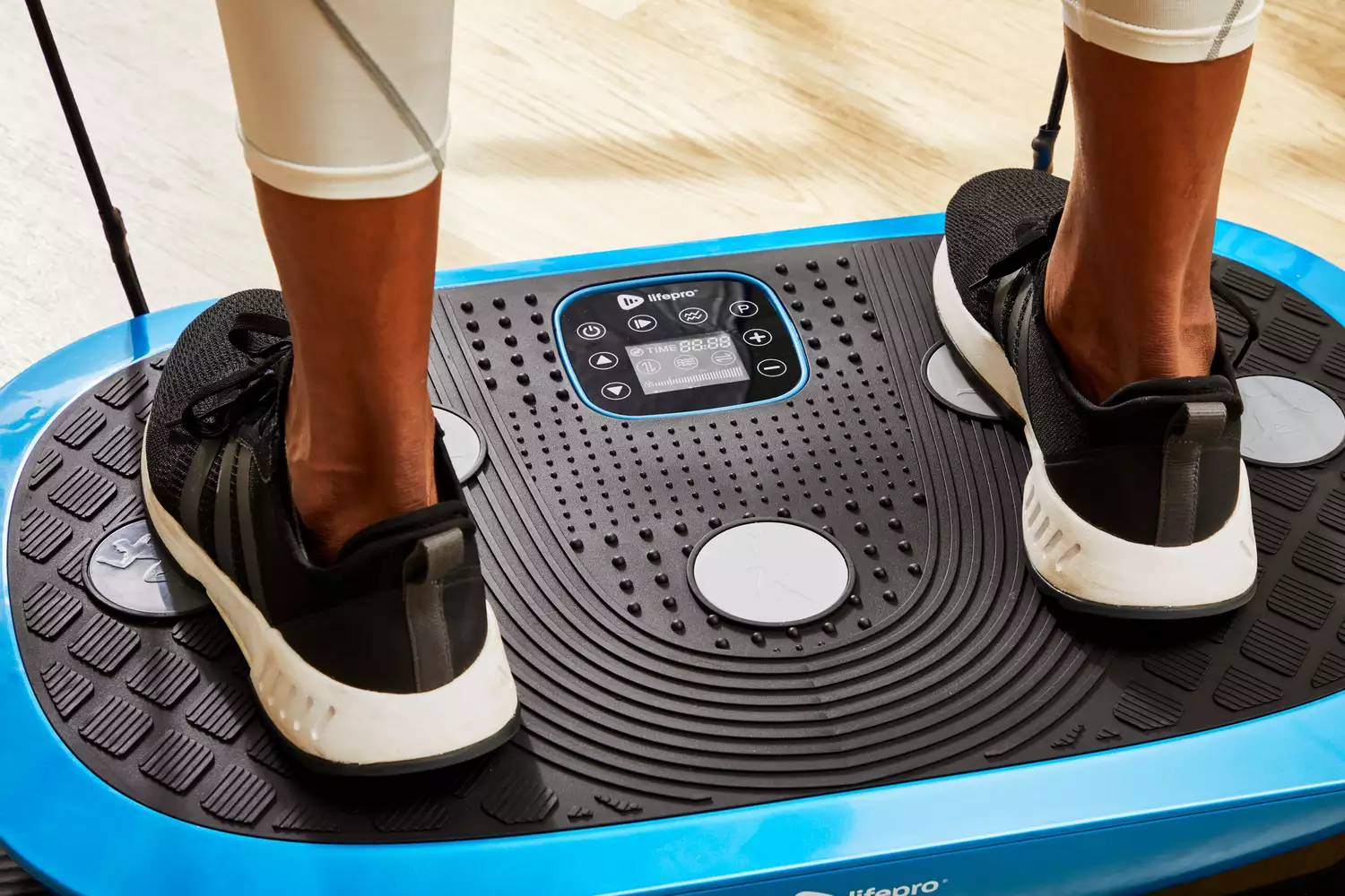 Feet stand on the LifePro Rumblex Plus 4D Vibration Plate Exercise Machine