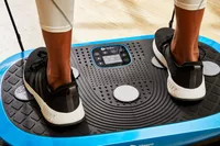 Feet stand on the LifePro Rumblex Plus 4D Vibration Plate Exercise Machine