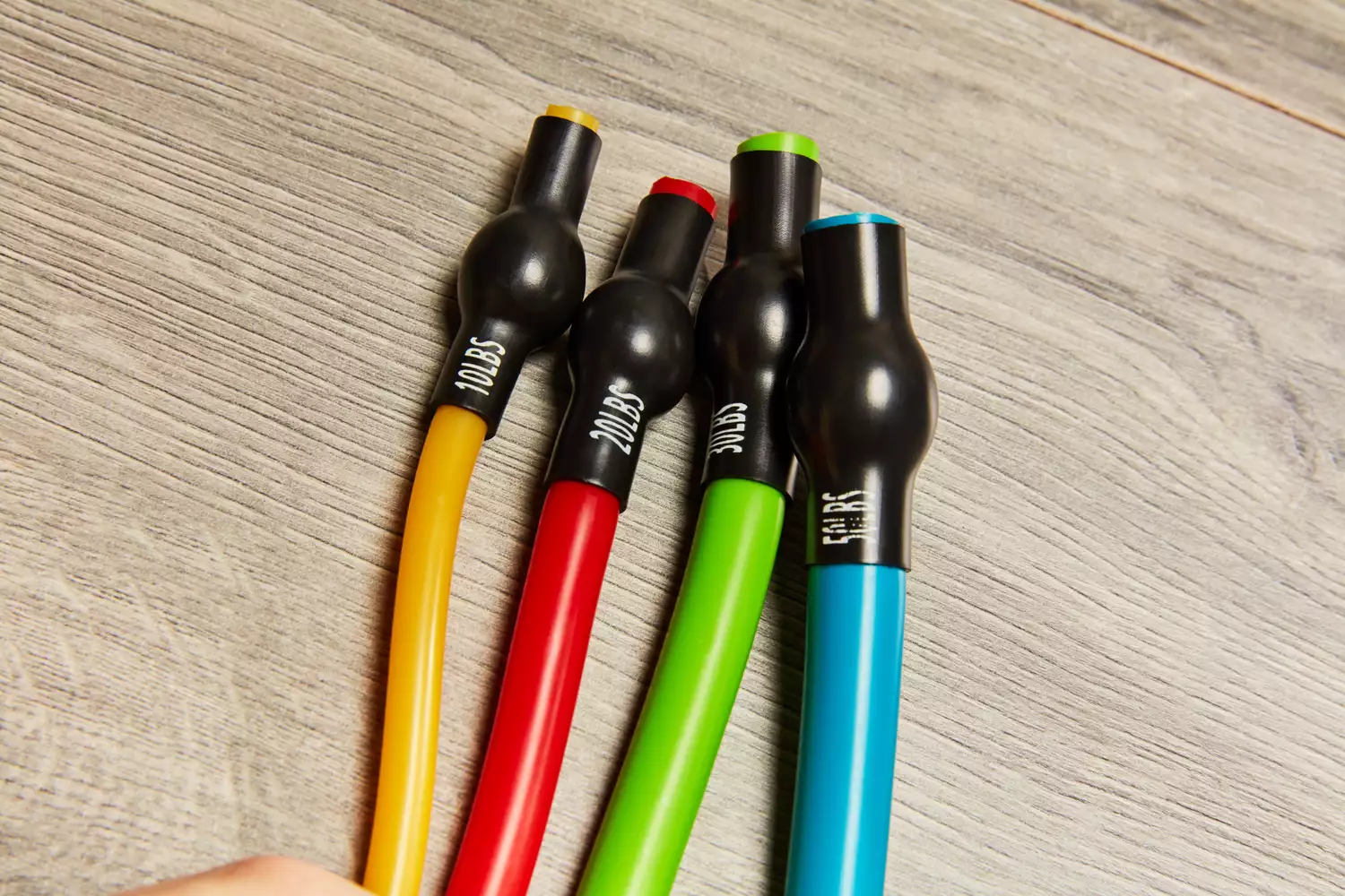 Closeup of the ends of the four resistance bands in the Gorilla Bow The Original Total Bundle