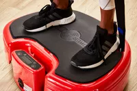 Feet stand on the Power Plate MOVE Vibrating Plate