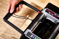 hand adjusting the weight on the POWERBLOCK Elite EXP Adjustable Dumbbell