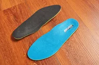 Top and bottom of Redi-Thotics Flex Orthotic Insoles displayed on a wood floor