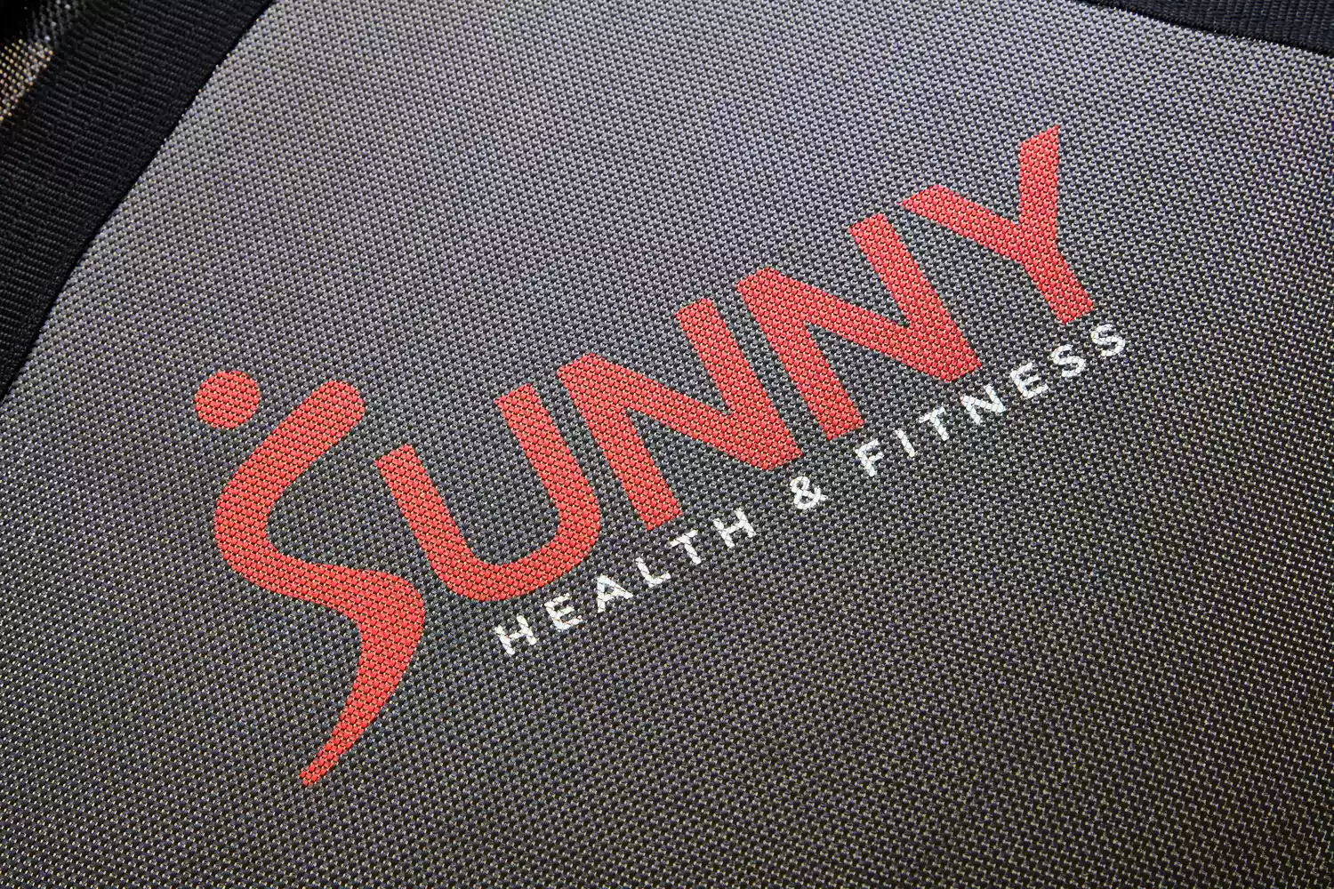 The logo of the Sunny Health & Fitness 36 Inch Indoor & Outdoor Exercise Trampoline up-close