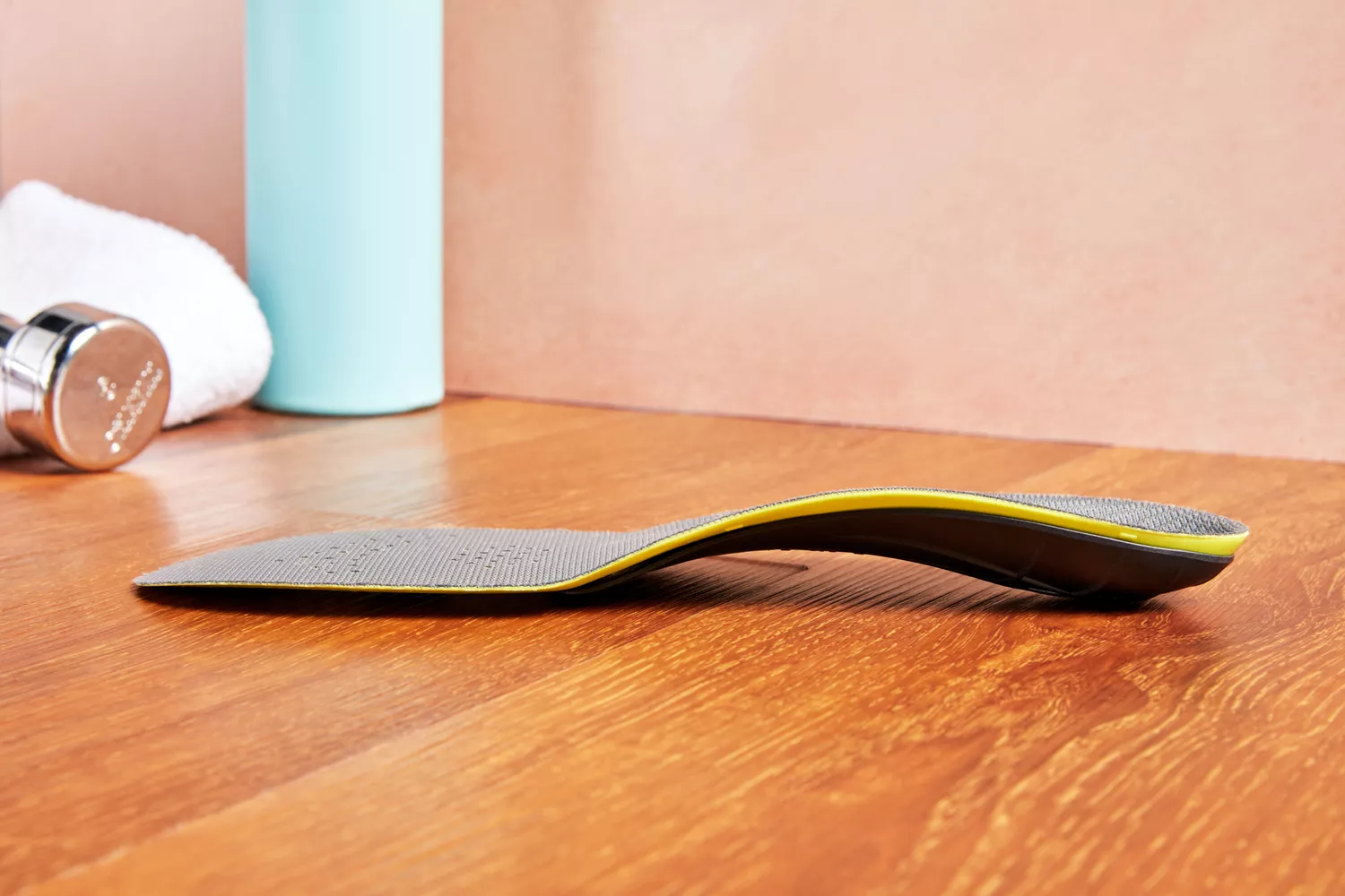 Superfeet Run Support Low Arch Shoe Insert displayed on a wood surface