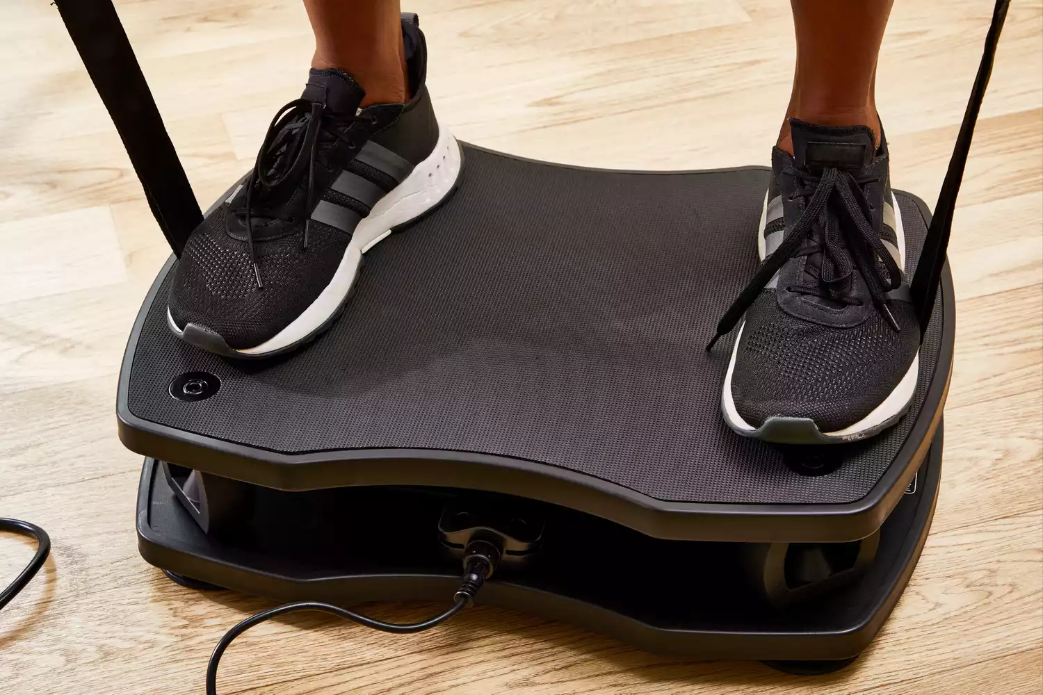Feet stand on the VT Vibration Therapeutic Frequency Vibration Plate