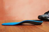 A sideview of the Walk-Hero Comfort and Support Plantar Fasciitis Insoles showing the arch height.