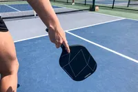 A person holds the Diadem A52 Pickleball Paddle