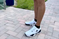 A side view of a person wearing the Diadem Court Burst Pickleball Shoes