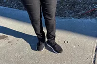 The Dr. Scholl's Women's Feel Support Lace Up Sneakers worn on concrete