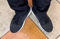 An overhead view of the Dr. Scholl's Women's Feel Support Lace Up Sneakers worn on tiles