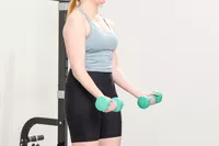 A person does arm curls with the Yes4All Neoprene Coated Dumbbells