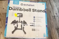 The box for the Echelon Strength Adjustable Dumbbells 752 with Stand