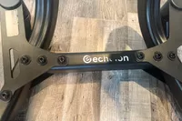The brand logo on the base of the Echelon Strength Adjustable Dumbbells 752 with Stand