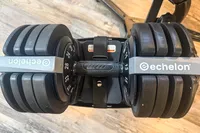 An overhead view of the Echelon Strength Adjustable Dumbbells 752 with Stand