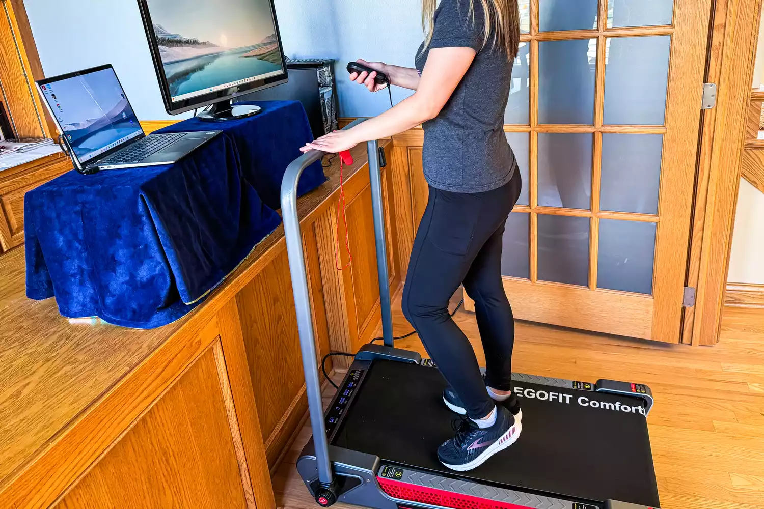 A person walks on the EGOFIT ComfortDeck-M2T Treadmill