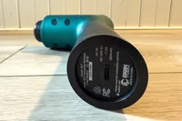 The charging port on the bottom of the Ekrin B37 Massage Gun