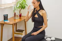 A person drinks a glass of REDMOND Re-Lyte Hydration Electrolyte Mix