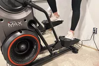 A close-up of a person's legs on the BowFlex Max Trainer M9