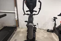 The BowFlex Max Trainer M9 next to other equiptment