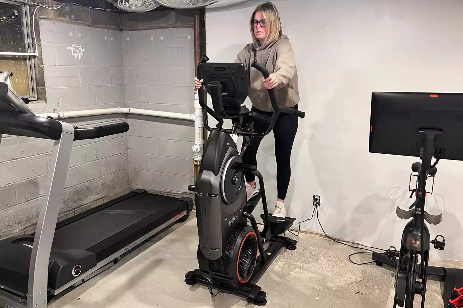 A person exercising on the BowFlex Max Trainer M9