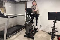 A person exercising on the BowFlex Max Trainer M9