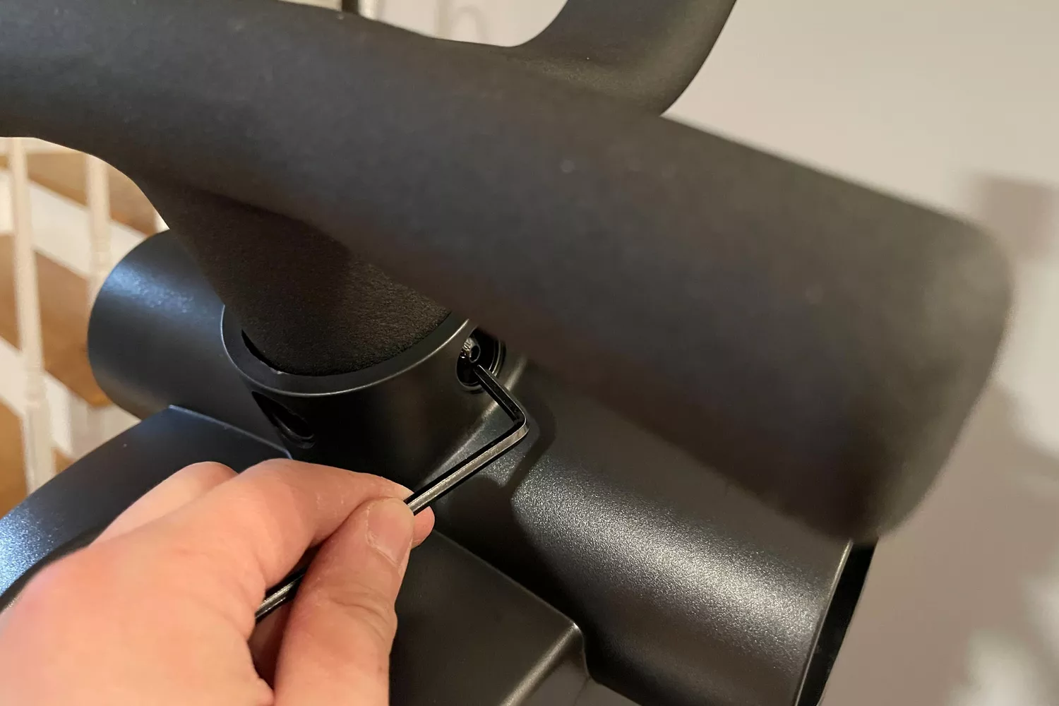 A person using a tool on the Bowflex Max Trainer SE