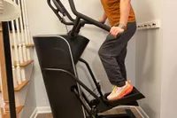 A person standing on the Bowflex Max Trainer SE