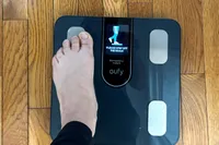 A person stands on one foot on the eufy Smart Scale C20