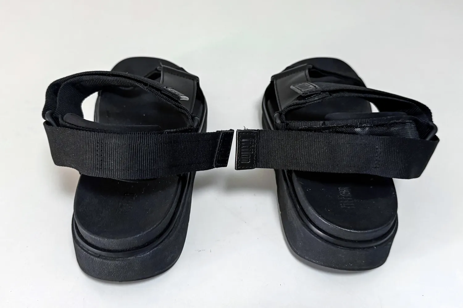 The back of a pair of FitFlop Women's GEN-FF Adjustable Webbing/Leather Back-Strap Sandals