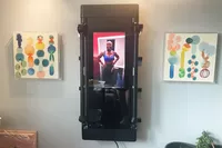 The Tonal fitness mirror set up on the wall and turned on
