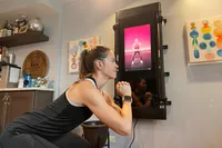 Person working out using the Tonal fitness mirror