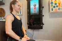 Person working out using the Tonal fitness mirror