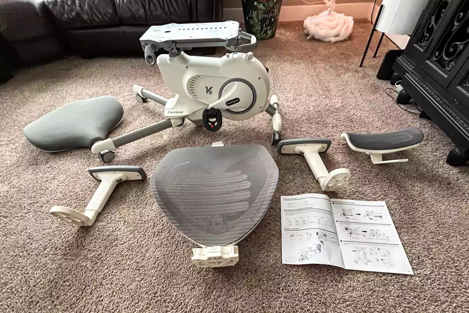 The Flexispot Deskbike V6 Pro parts and instructions on carpet