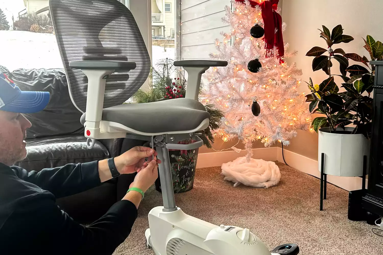 A close-up of a person assembling the Flexispot Deskbike V6 Pro