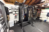 The Force USA G20 Pro All-In-One Trainer in a home gym with other workout equipment