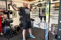 A person works out on the Force USA G20 Pro All-In-One Trainer