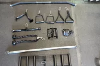 The Force USA G20 Pro All-In-One Trainer's varied lifting handle kit on a gym floor