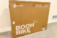 The Freebeat Boom Bike in a cardboard shipping box