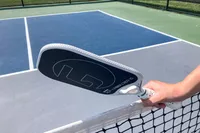 A person holds the GAMMA Airbender 10 Pickleball Paddle